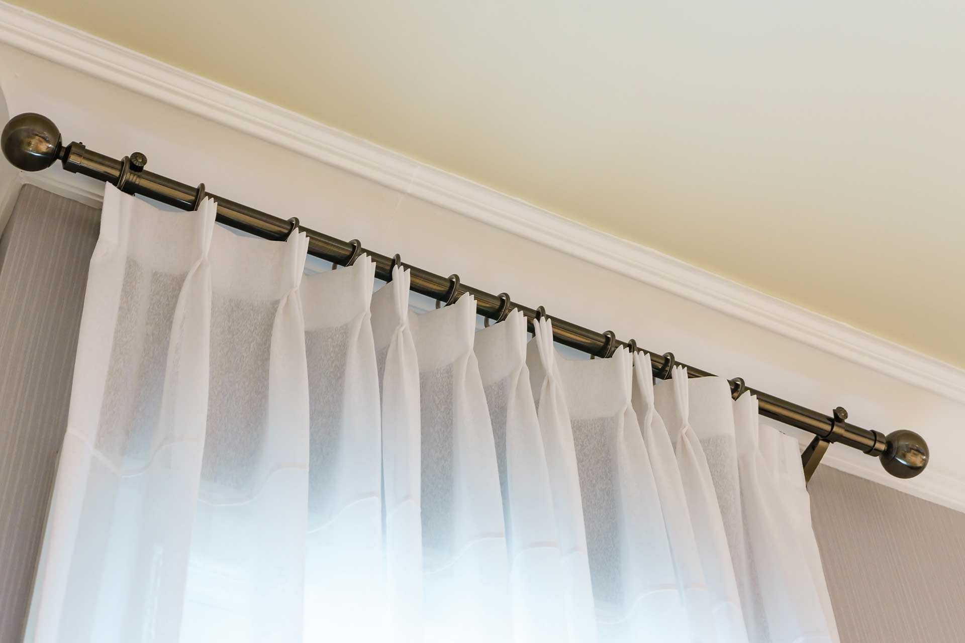 What are the 2 different ways you can hang curtains?